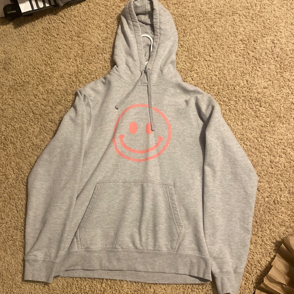 gray with pink smiley face hoodie size women’s medium.